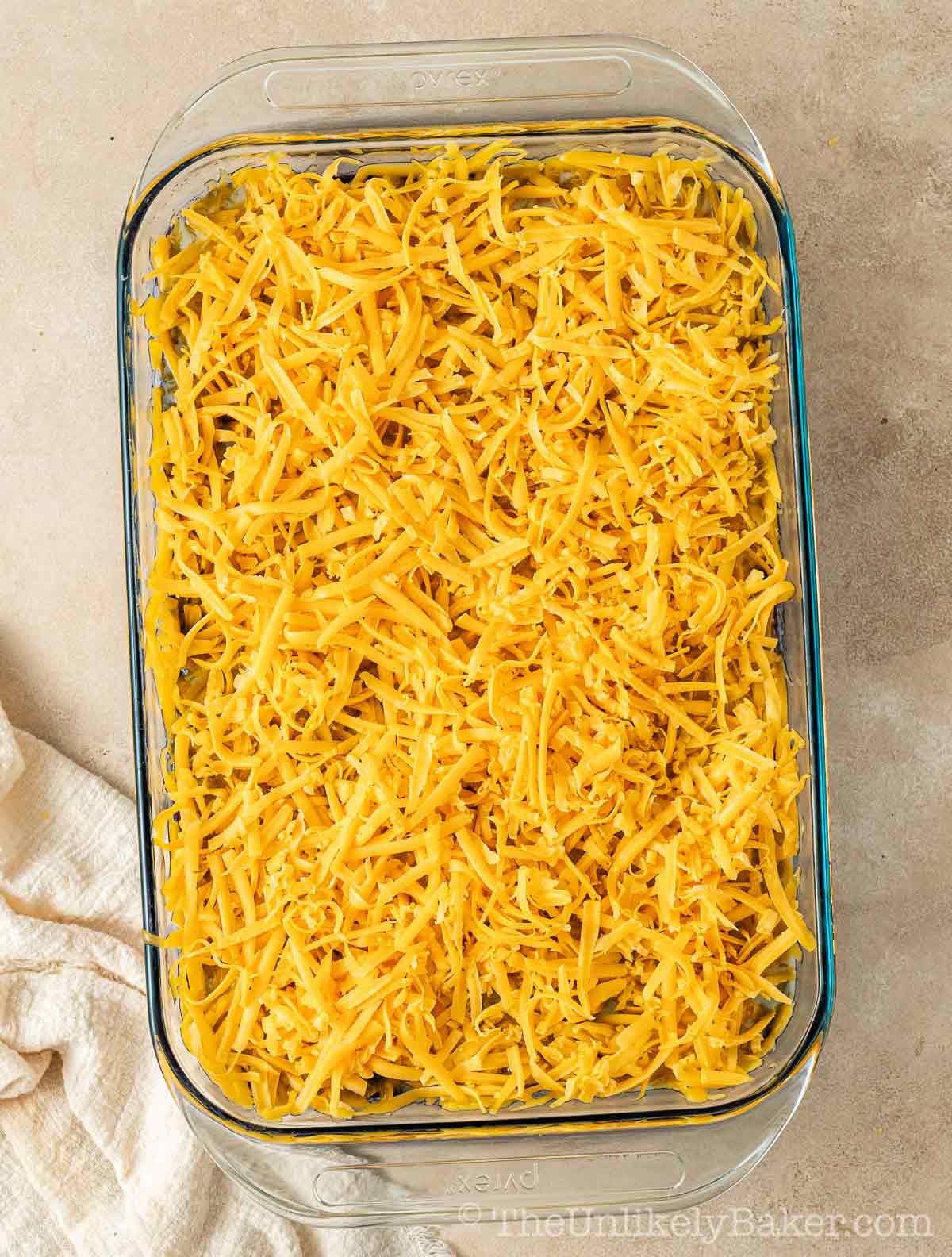 Shredded cheese on top of baked cake.