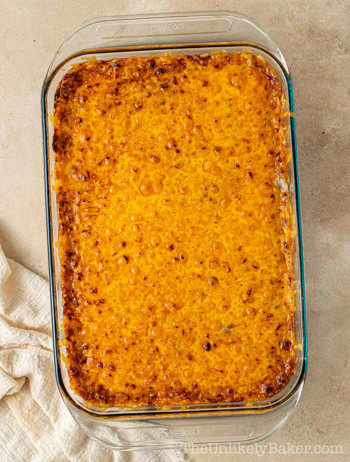 Freshly baked ube cassava cake in a baking dish.