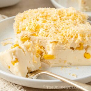 Creamy maja blanca with corn topped with cheese.