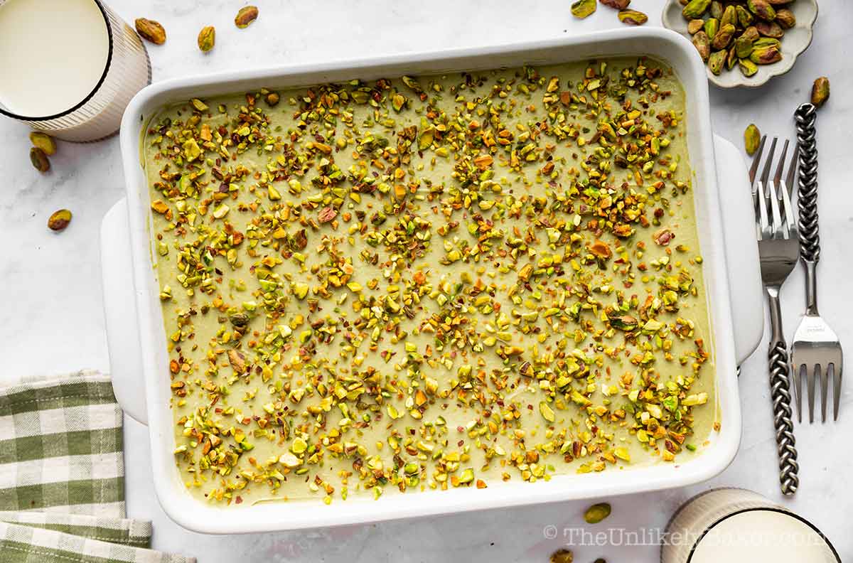 Creamy pistachio tiramisu topped with chopped pistachio nuts.
