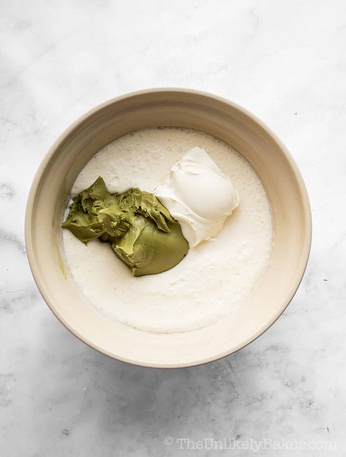 Mascarpone cheese added to heavy cream mixture.
