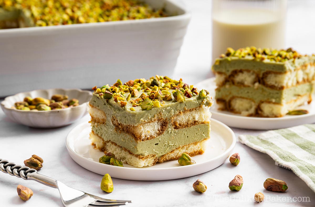 A slice of pistachio tiramisu cake.