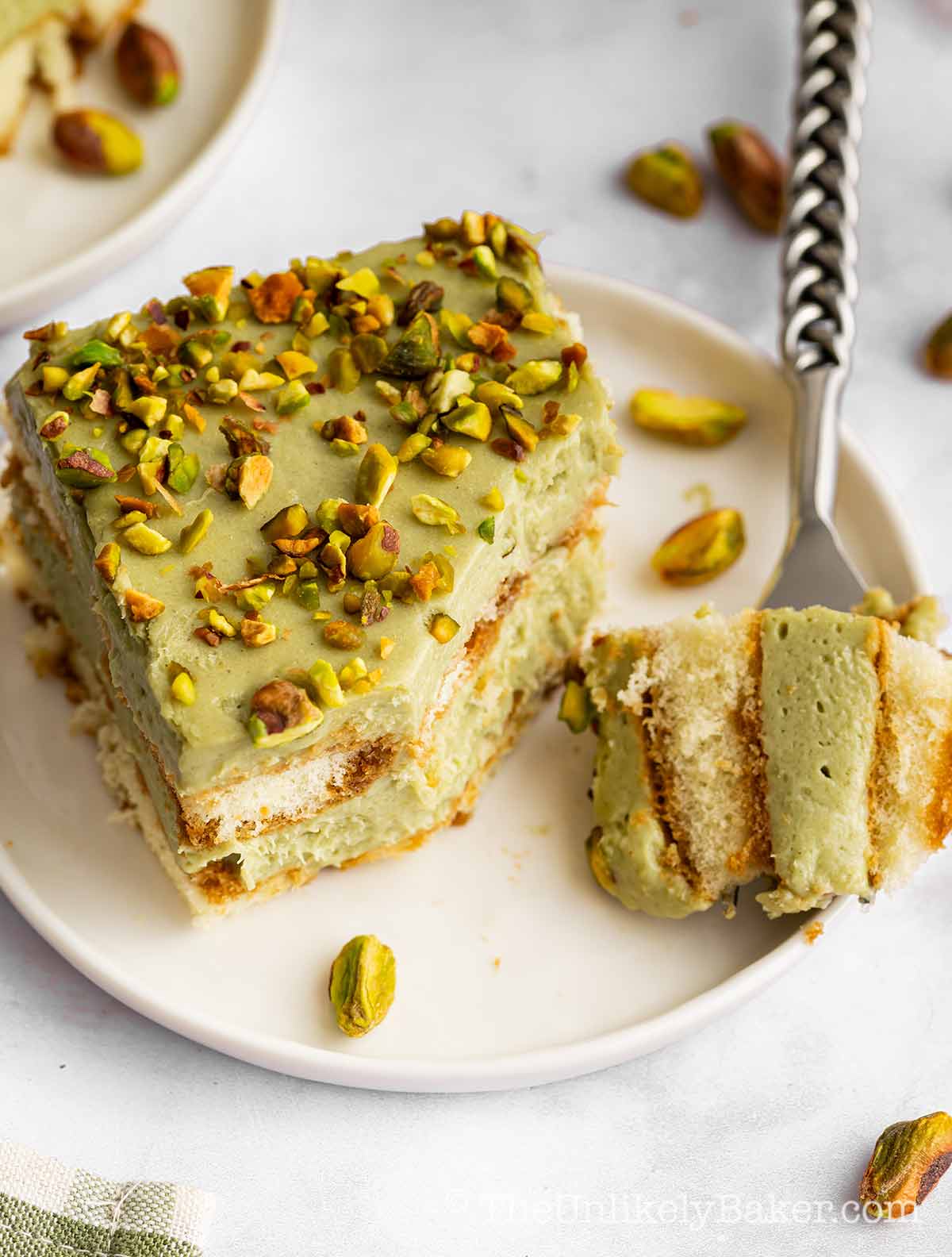 Pistachio cream tiramisu on a plate.