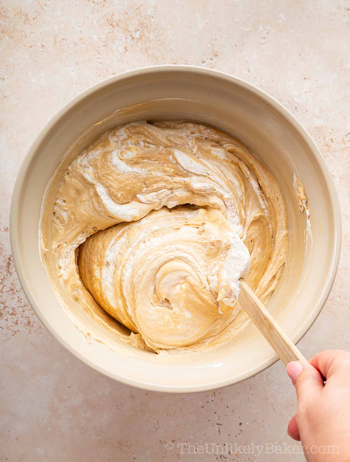 Whipped cream folded into cookie butter mixture.