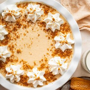 No bake cookie butter pie topped with whipped cream.