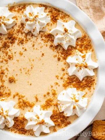 No bake cookie butter pie topped with whipped cream.