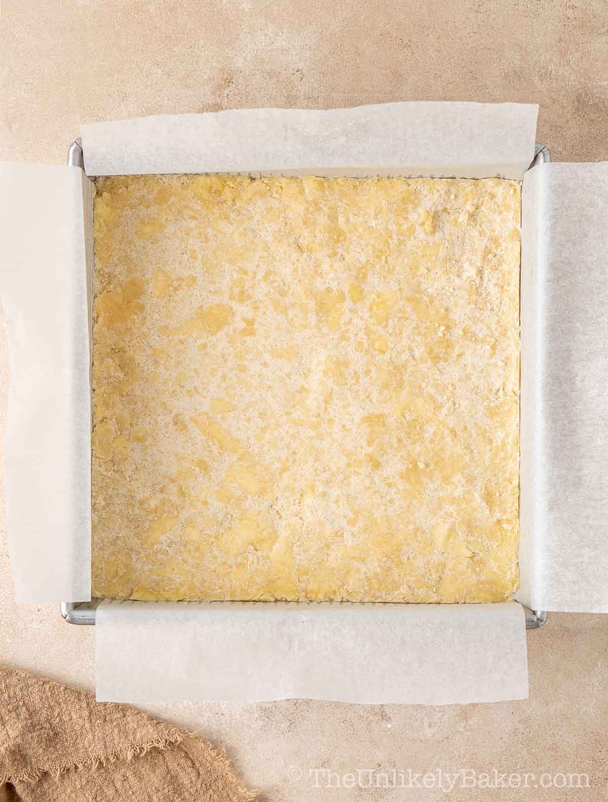Butter crust mixture transfered to pan.