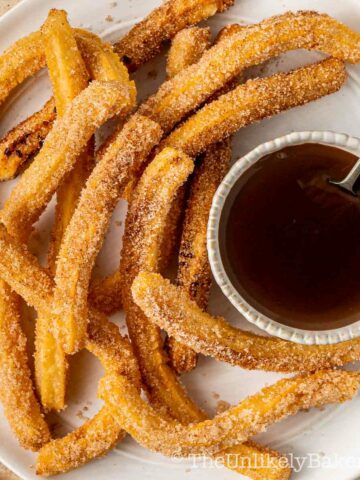 Crispy churros with chocolate dipping sauce.